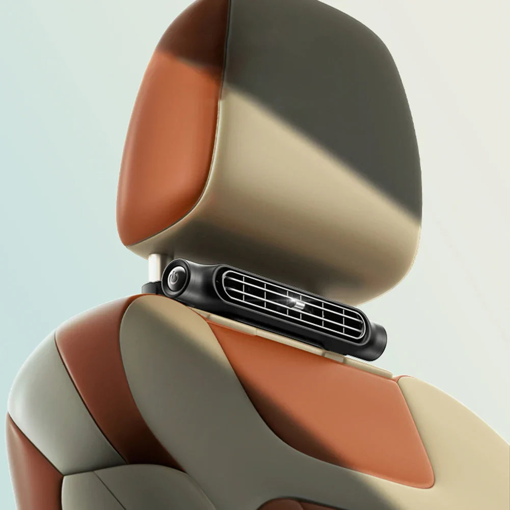 Fan clipped onto headrest posts
